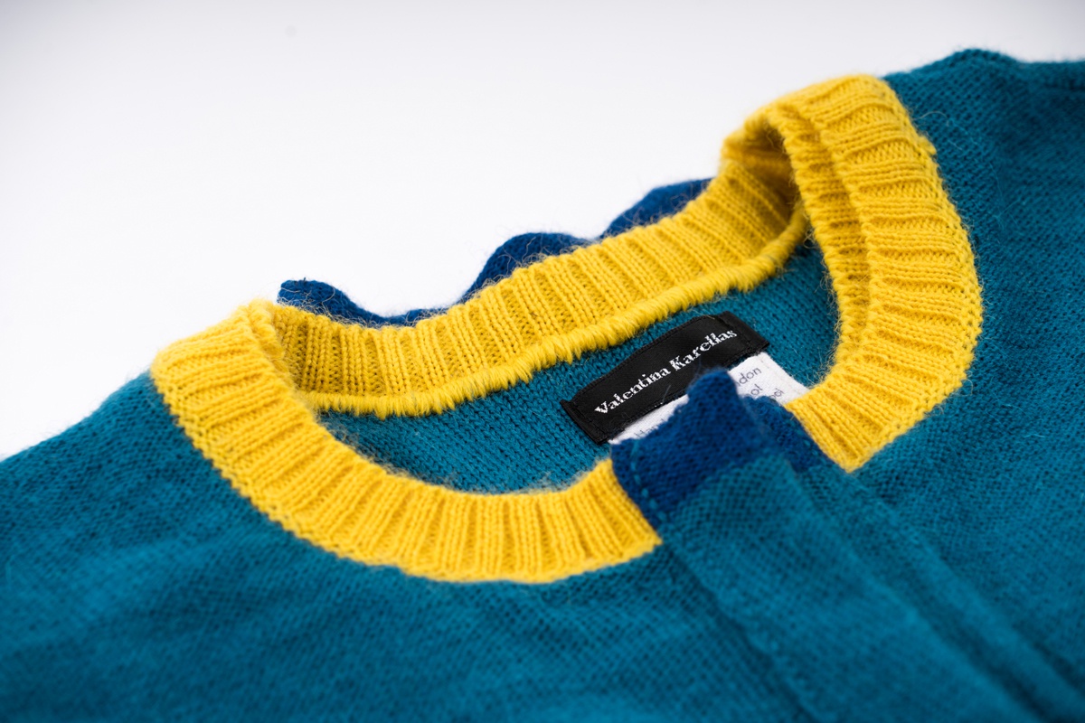 close up knitted jacket green wool